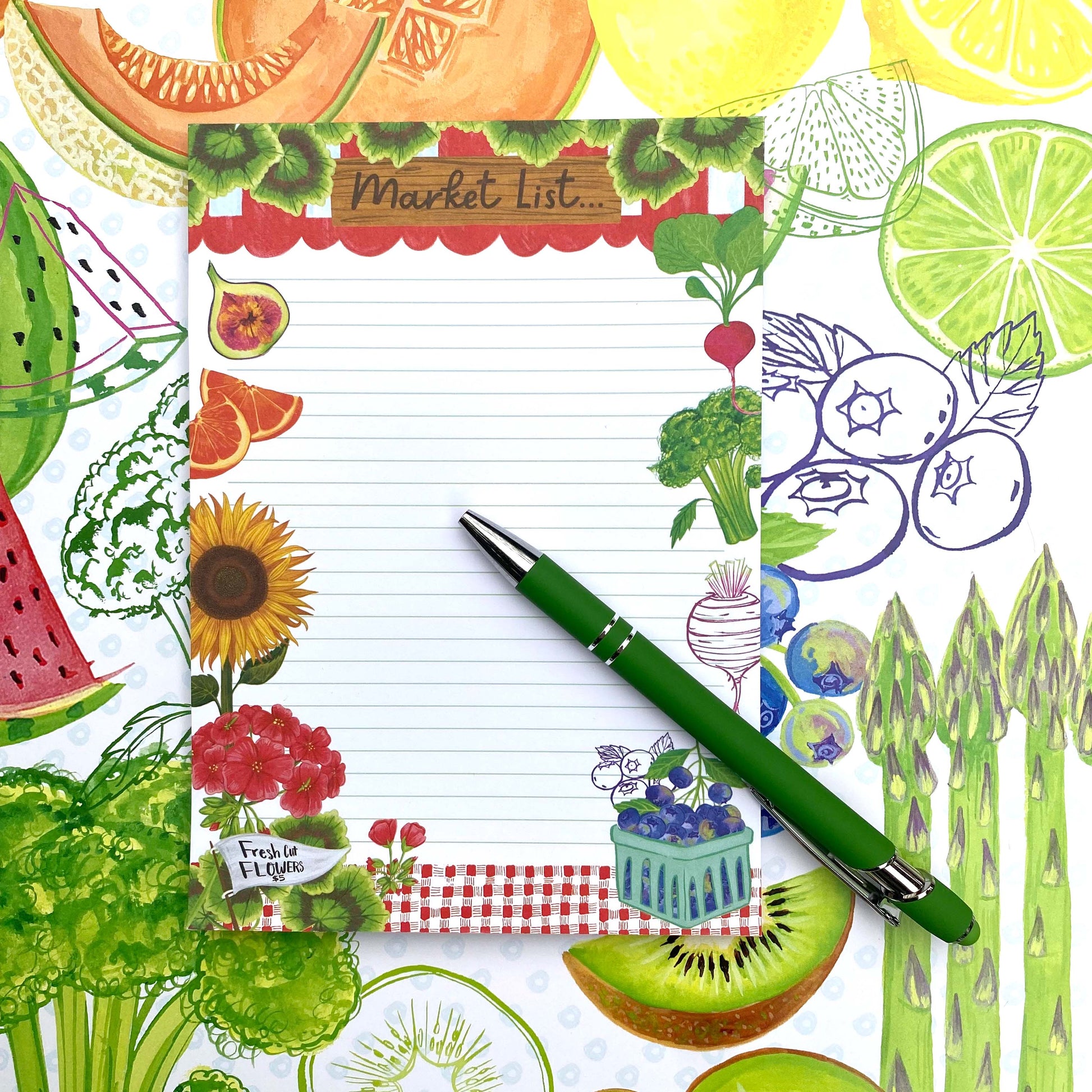 White background with colorful fruits and vegetables. A Market List Notepad sits on top of this illustration containing illustrations of fruits, vegetables and flowers. A green pen sits on top of the notepad.