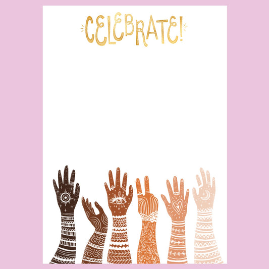 White note pad with diverse multi racially colored hands with arms extended up. the word Celebrate is at the top. Notepad sits on a lavender colored background.