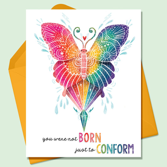 Rainbow colored butterfly image with white decorative details on a white background. The words You Were Not Born Just to Conform written on the greeting card. There is an orange envelope that sits on a mint green background.