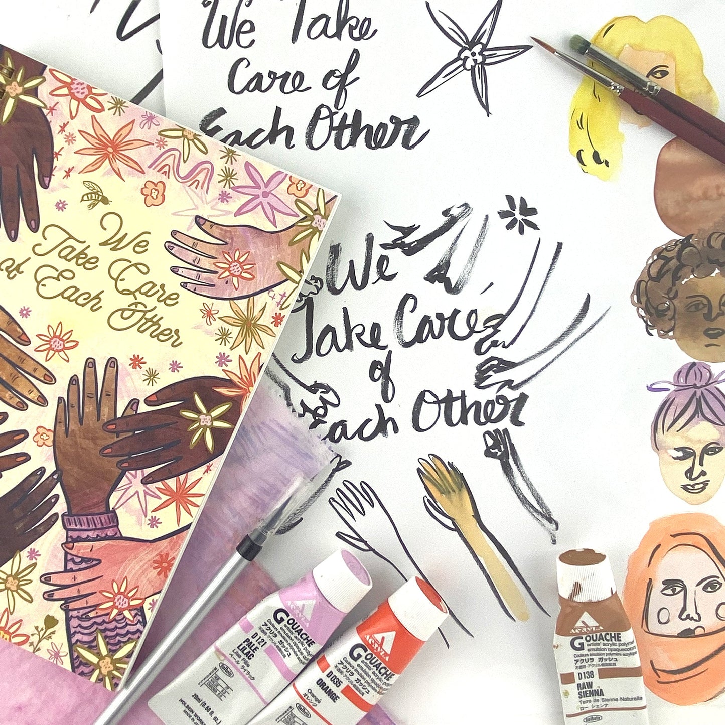 Spiral Bound notebook with hand drawn artwork of multi racial hands and flowers. In the center text says We Take Care of Each Other. White background with black in drawings and 3 tubes of colorful paint, paint brush, and illustrations of women's faces. 